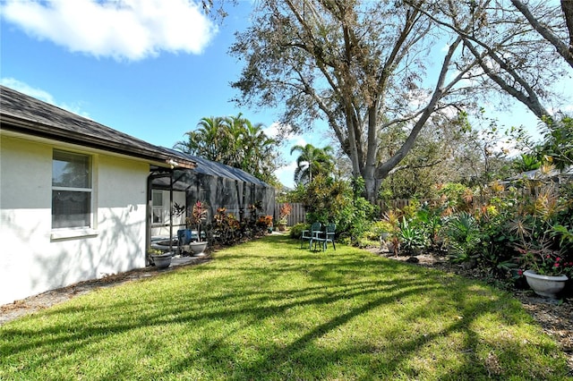 view of yard featuring a lanai