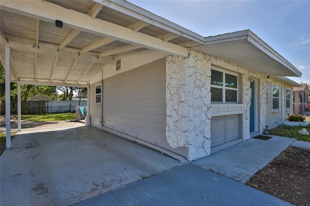 view of side of home with a patio