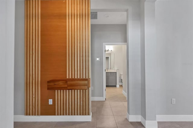 corridor with light tile patterned flooring