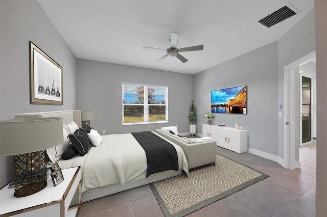 bedroom with ceiling fan and light tile patterned floors