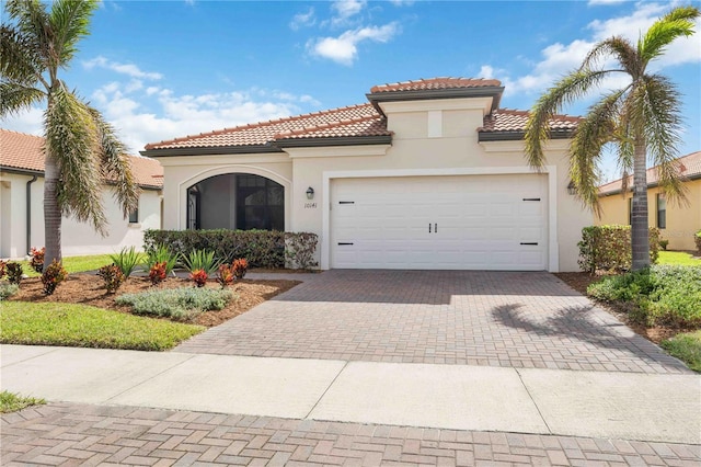 mediterranean / spanish-style home featuring a garage