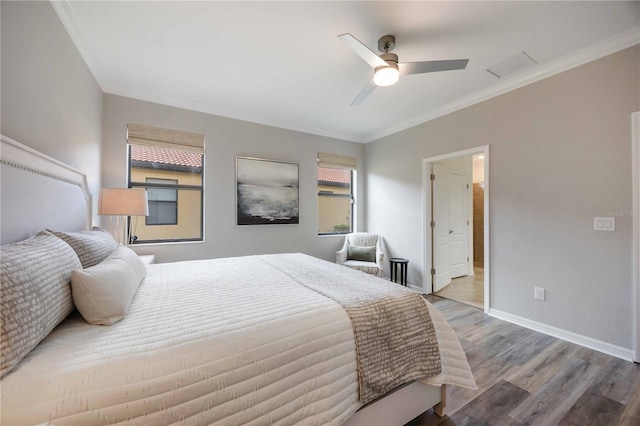 bedroom featuring ceiling fan, wood-type flooring, and ornamental molding