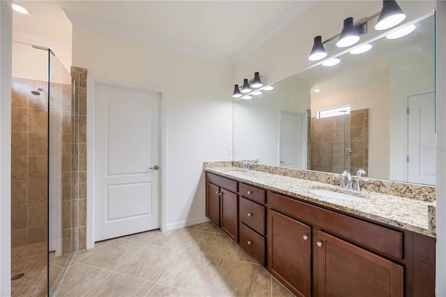 bathroom featuring ornamental molding, vanity, tile patterned floors, and tiled shower