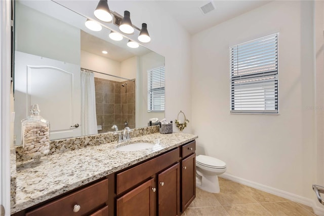 bathroom with toilet, vanity, a shower with shower curtain, and tile patterned flooring