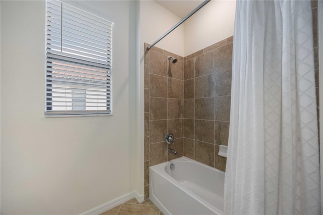 bathroom with tile patterned flooring and shower / bath combo