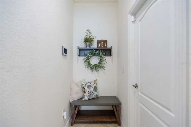 mudroom with tile patterned floors