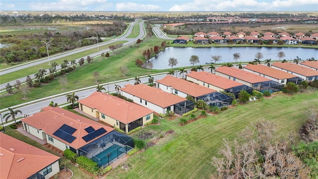 birds eye view of property with a water view