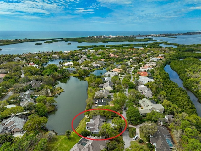 birds eye view of property featuring a water view