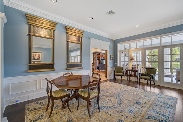 dining room with french doors, ornamental molding, and dark wood-type flooring