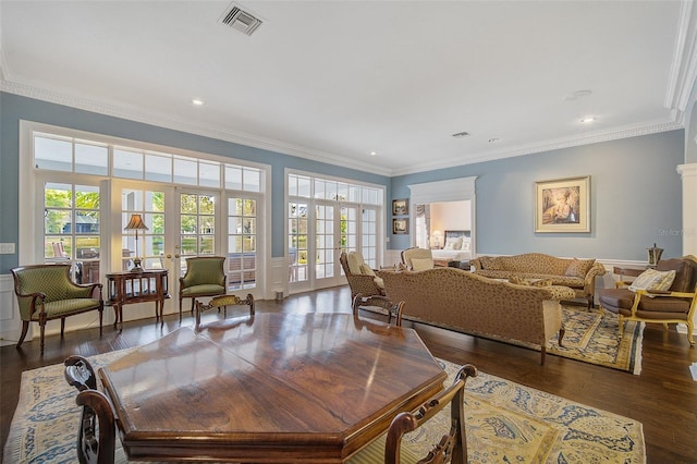 living room featuring french doors, crown molding, and dark hardwood / wood-style floors