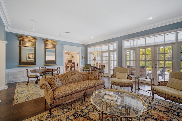 living room with ornamental molding, french doors, and dark hardwood / wood-style flooring