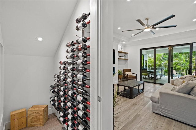 wine room featuring ceiling fan and light hardwood / wood-style floors