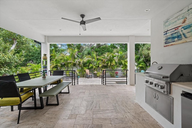 view of patio / terrace featuring exterior kitchen, ceiling fan, and area for grilling