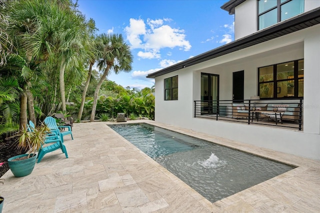 view of swimming pool featuring a patio