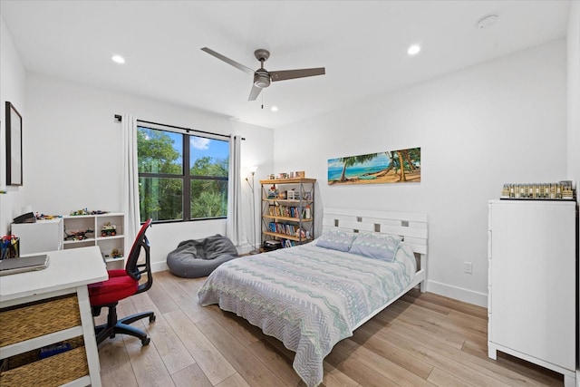 bedroom featuring ceiling fan and light wood-type flooring