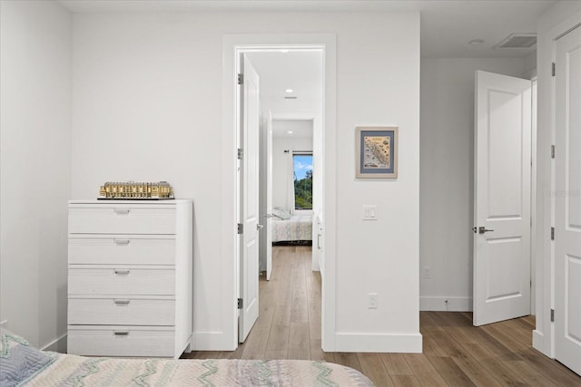577 Venice Ln, Sarasota, FL 34242 - bedroom with wood finished floors and baseboards