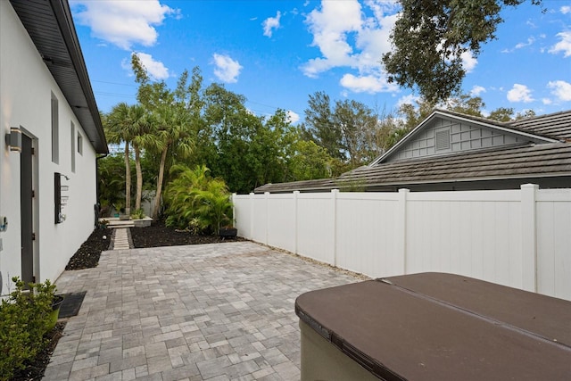 view of patio featuring a jacuzzi