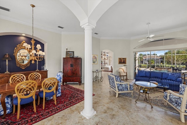 dining room featuring ceiling fan with notable chandelier, ornate columns, and crown molding