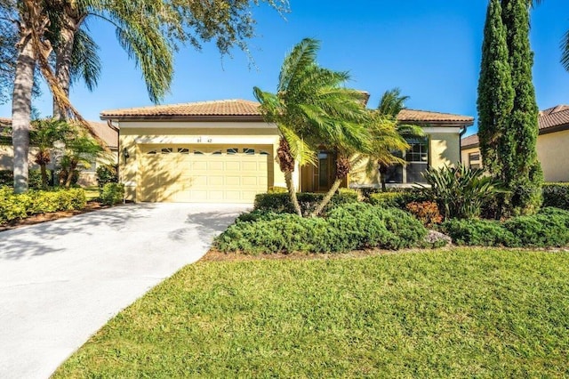 view of front facade featuring a front yard and a garage