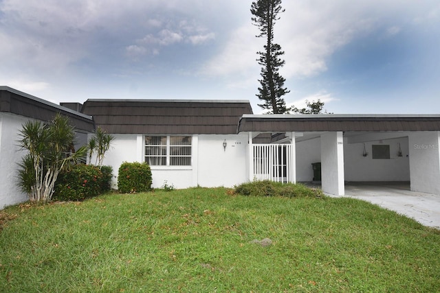 rear view of property with a yard