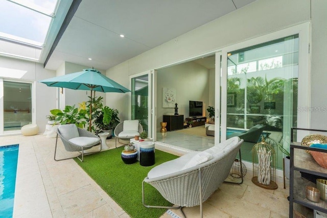 sunroom / solarium with a skylight