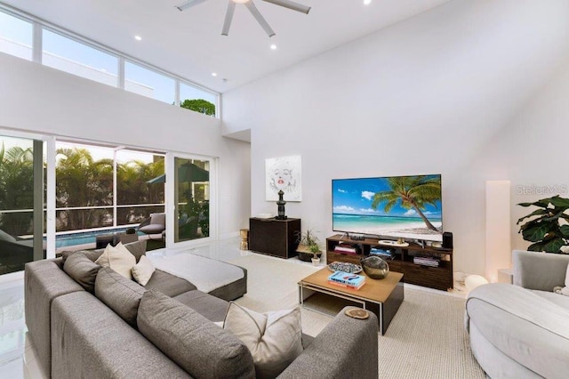 living room featuring a wealth of natural light and high vaulted ceiling