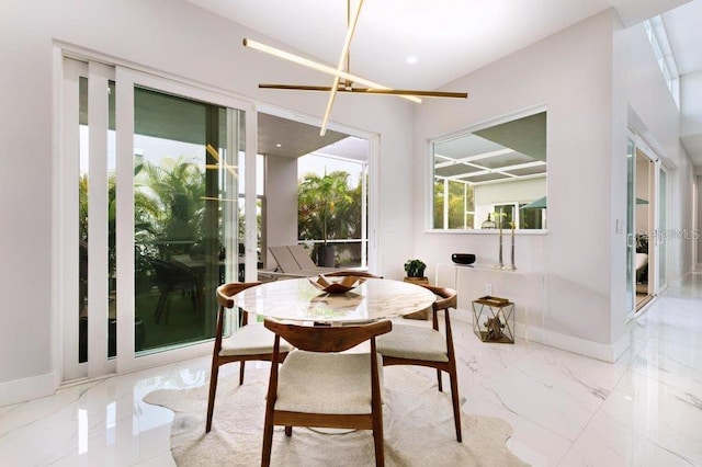 dining space featuring an inviting chandelier