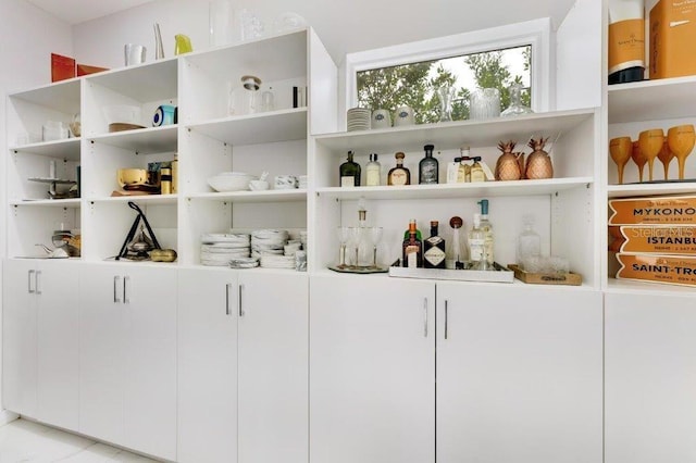 bar with white cabinetry