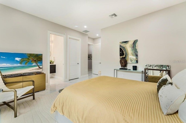 bedroom featuring ensuite bath