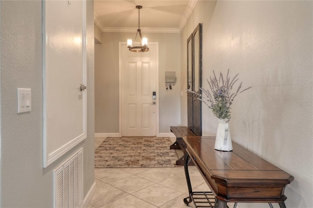 doorway to outside featuring light tile patterned floors, baseboards, visible vents, ornamental molding, and a chandelier