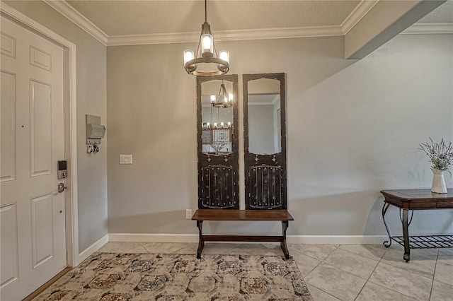 foyer featuring light tile patterned floors, ornamental molding, a chandelier, and baseboards