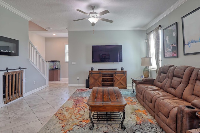 living room with light tile patterned floors, a textured ceiling, stairway, and a wealth of natural light