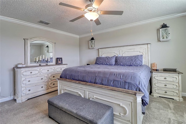 carpeted bedroom featuring visible vents, ornamental molding, ceiling fan, a textured ceiling, and baseboards