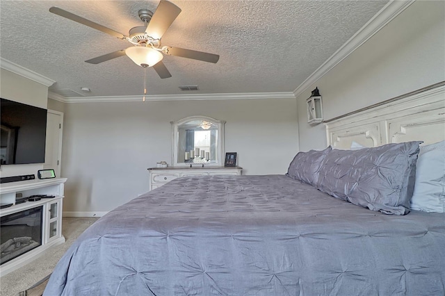 bedroom with crown molding, light colored carpet, visible vents, a ceiling fan, and a textured ceiling