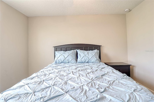 bedroom featuring a textured ceiling