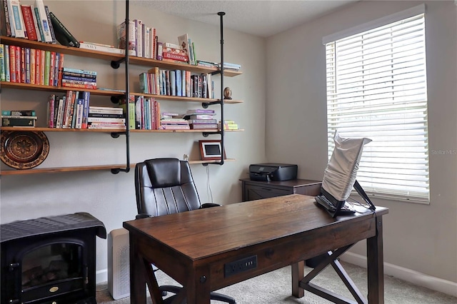 office space featuring carpet and baseboards