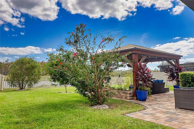 view of yard with a patio area, a fenced backyard, and a gazebo