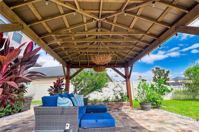 view of patio featuring an outdoor hangout area, a gazebo, and a fenced backyard