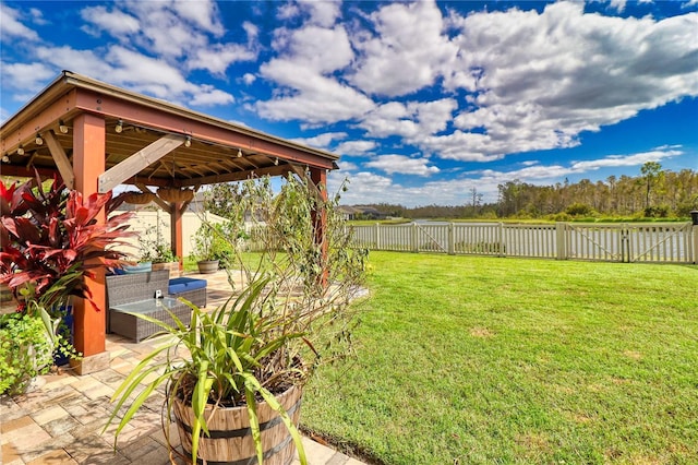 view of yard featuring a gazebo, a patio area, and a fenced backyard