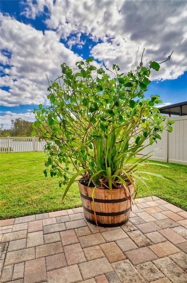 view of patio featuring fence