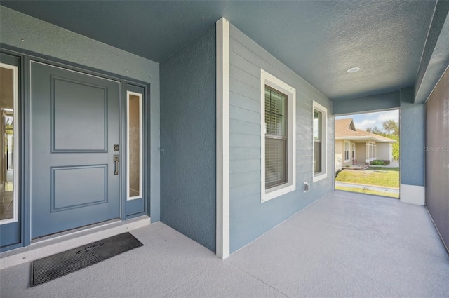 entrance to property with covered porch