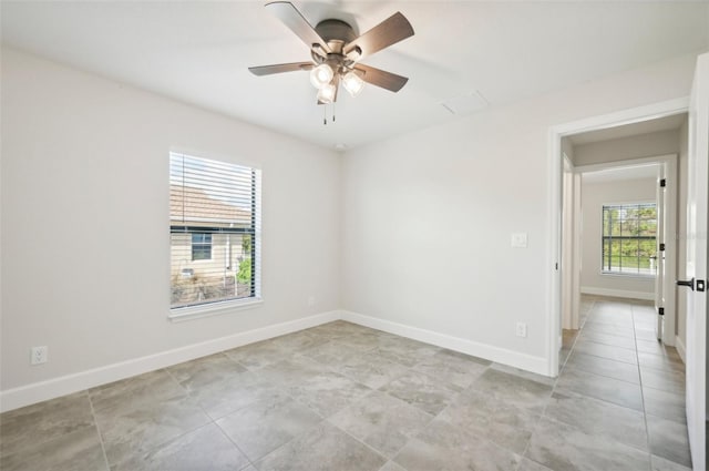 tiled empty room with ceiling fan