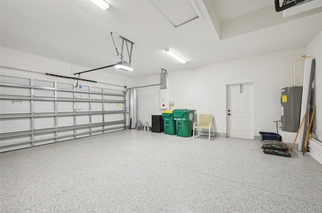 garage featuring electric water heater and a garage door opener