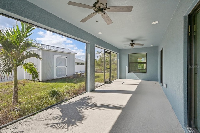 sunroom featuring ceiling fan