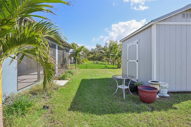 view of yard with a storage unit