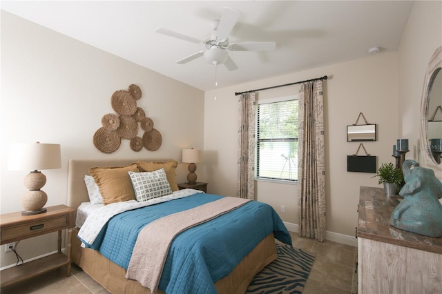 bedroom featuring ceiling fan and light tile patterned floors