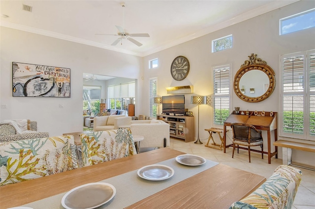 dining area with ceiling fan, a wealth of natural light, and visible vents