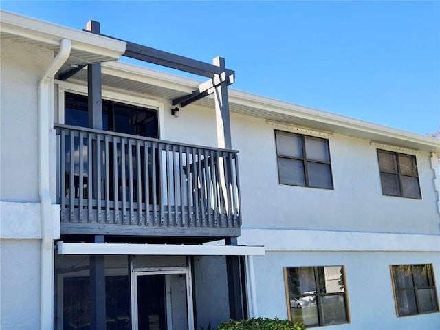 view of side of home with a balcony