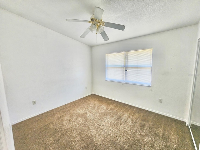 carpeted empty room featuring a textured ceiling and ceiling fan