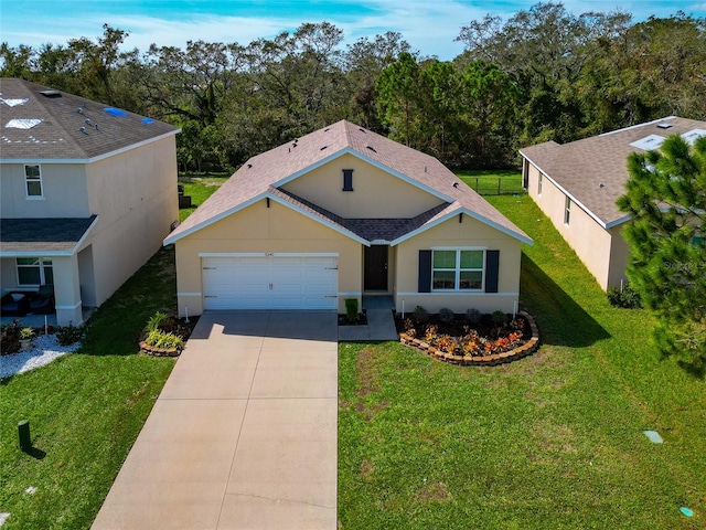 view of front of home featuring a garage and a front yard